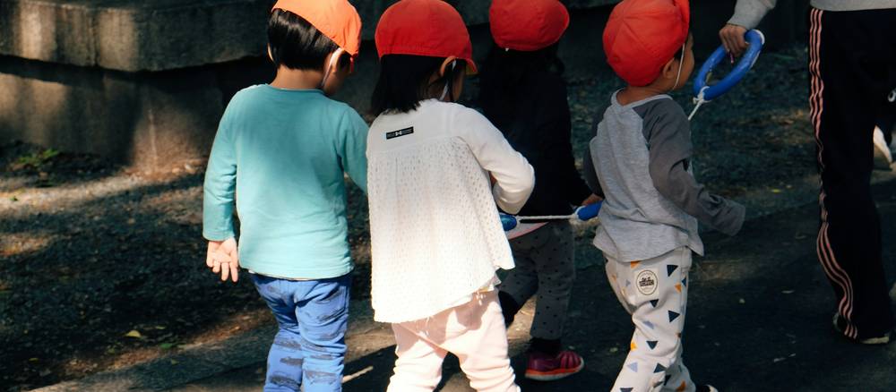 Children working together on group learning and teamwork games, building collaboration skills